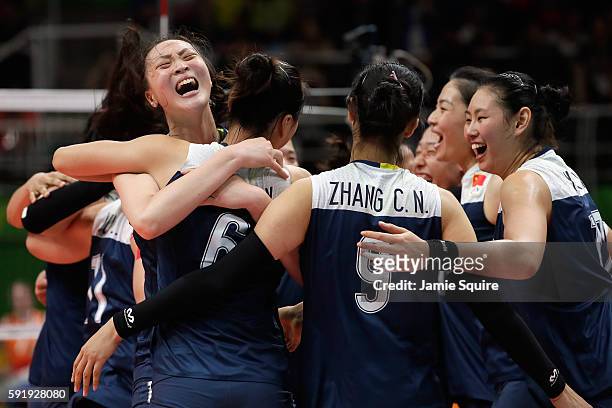 Ruoqi Hui of China celebrates victory over the Netherlands with her teammates in the Women's Volleyball Semifinal match at the Maracanazinho on Day...