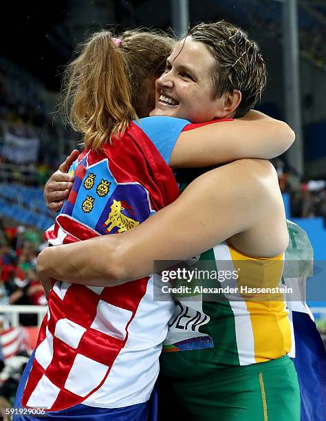 Sara Kolak of Croatia celebrates after winning gold with silver medalist Sunette Viljoen of South Africa after the Women's Javelin Final on Day 13 of...