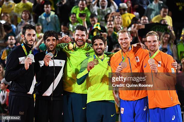 Silver medalists Paolo Nicolai and Daniele Lupo of Italy, gold medalists Alison Cerutti and Bruno Schmidt Oscar of Brazil and bronze medalists...