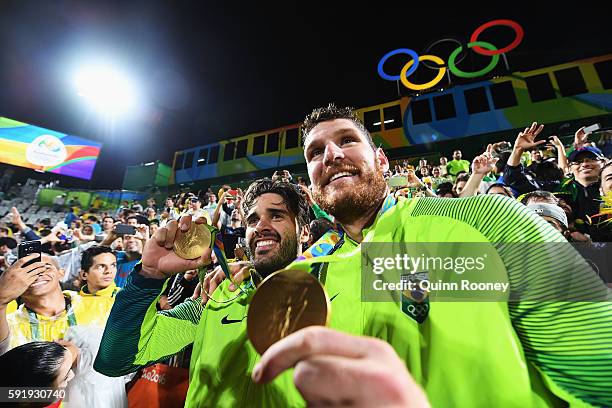 Gold medalists Alison Cerutti and Bruno Schmidt Oscar of Brazil celebrate following the medal ceremony for the Men's Beachvolleyball contest at the...