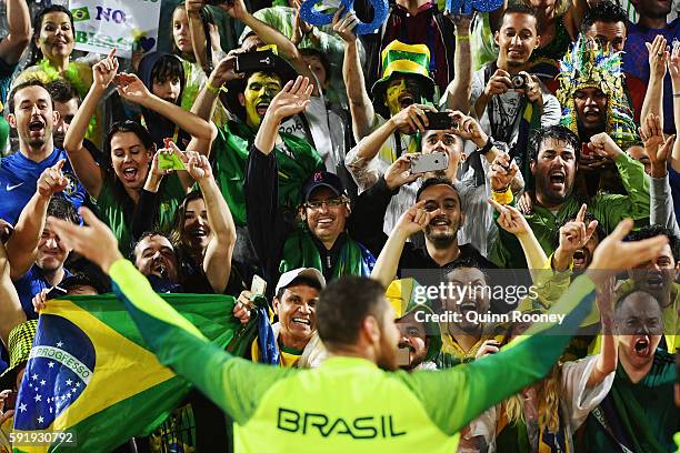 Gold medalist Alison Cerutti of Brazil celebrates following the medal ceremony for the Men's Beachvolleyball contest at the Beach Volleyball Arena on...