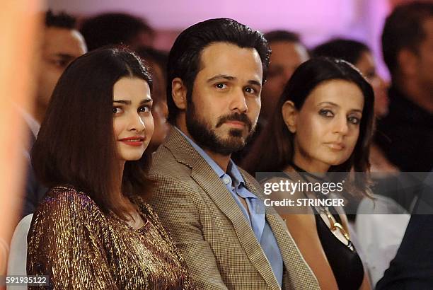 Indian Bollywood actors Prachi Desai, Emraan Hashmi and Ameesha Patel attend the launch of Rebecca Deans new designer label in Mumbai on August 18,...