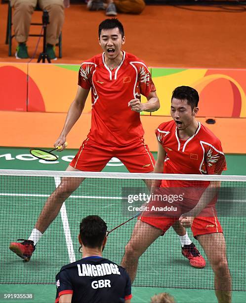 Chai Biao and Hong Wei of China celebrate a point against Ellis Marcus and Langridge Chris of Britain in the Mens Doubles Bronze Medal Match on Day...