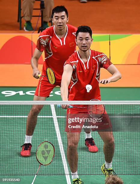 Chai Biao and Hong Wei of China compete against Ellis Marcus and Langridge Chris of Britain in the Mens Doubles Bronze Medal Match on Day 13 of the...