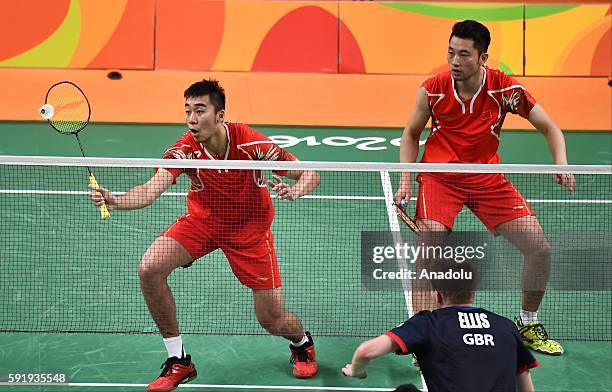 Chai Biao and Hong Wei of China compete against Ellis Marcus and Langridge Chris of Britain in the Mens Doubles Bronze Medal Match on Day 13 of the...