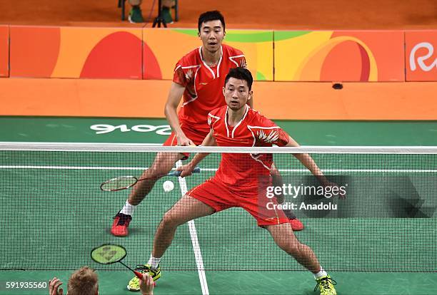 Chai Biao and Hong Wei of China compete against Ellis Marcus and Langridge Chris of Britain in the Mens Doubles Bronze Medal Match on Day 13 of the...