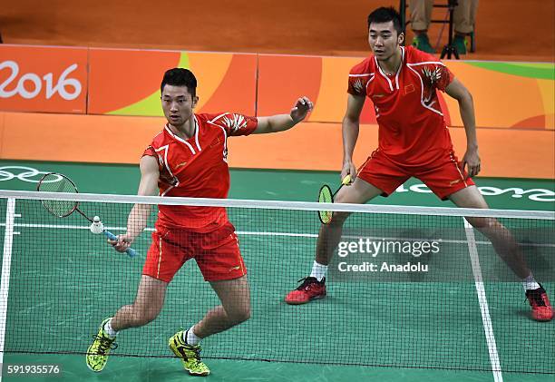 Chai Biao and Hong Wei of China compete against Ellis Marcus and Langridge Chris of Britain in the Mens Doubles Bronze Medal Match on Day 13 of the...