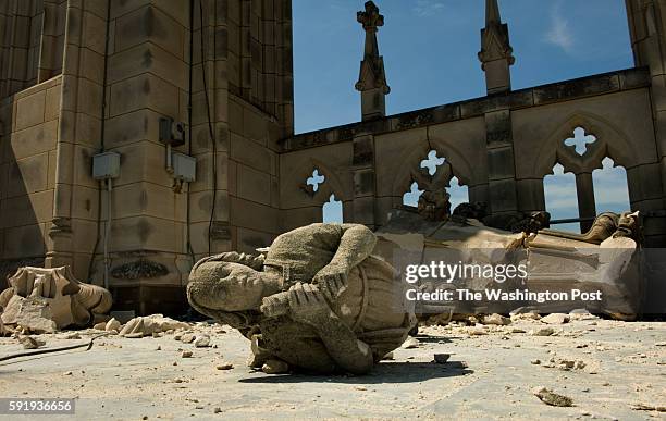 An angel, dislodged from the southwest pinnacle of the "Gloria in Excelsis" or central tower sits on the roof of The Washington National Cathedral...