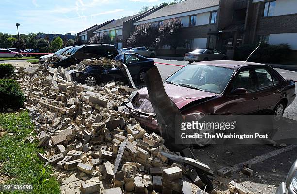Witness says when the earthquake hit, bricks fell off the 8304 Old Georgetown Rd building in Vienna, VA and smashed these four vehicles on August 23,...