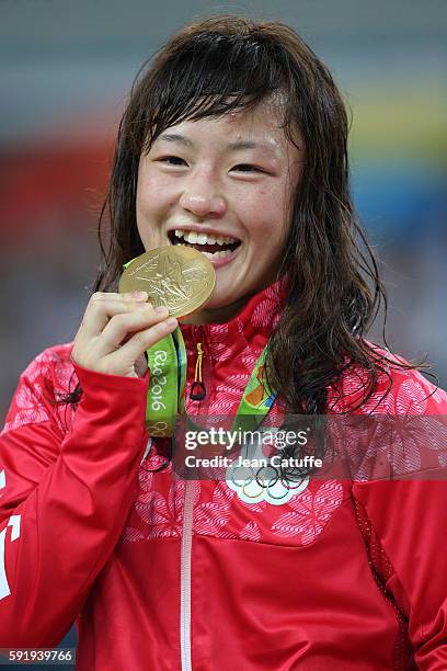 Eri Tosaka of Japan celebrates winning the gold medal in the Women's Freestyle 48 kg in the wrestling competition on day 12 of the Rio 2016 Olympic...