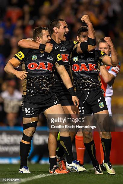 Trent Merrin of the Panthers celebrates scoring a try with team mates during the round 24 NRL match between the Penrith Panthers and the Wests Tigers...