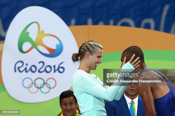 Ashton Eaton of the United States embraces wife Brianne Theisen-Eaton after the Men's Decathlon 1500m and winning gold overall on Day 13 of the Rio...