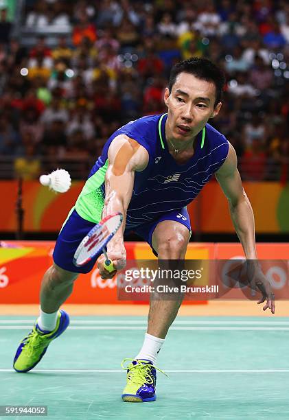 Chong Wei Lee of Malaysia competes against Dan Lin of China during the Men's Singles Badminton Semi-final against on Day 14 of the Rio 2016 Olympic...