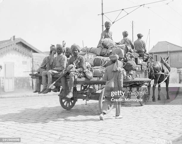 Soldiers part of the 3rd Indian Division seen here escorting one of the transports from the docks to their rest camp on the race course at...