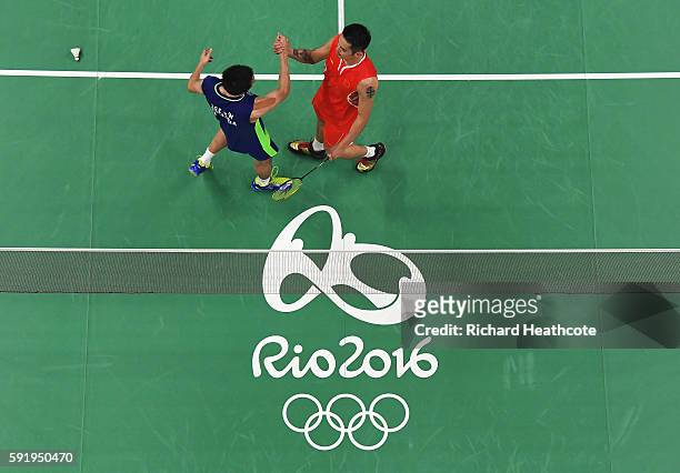 Chong Wei Lee of Malaysia shakes hands with Dan Lin of China after winning the Men's Singles Badminton Semi-final on Day 14 of the Rio 2016 Olympic...