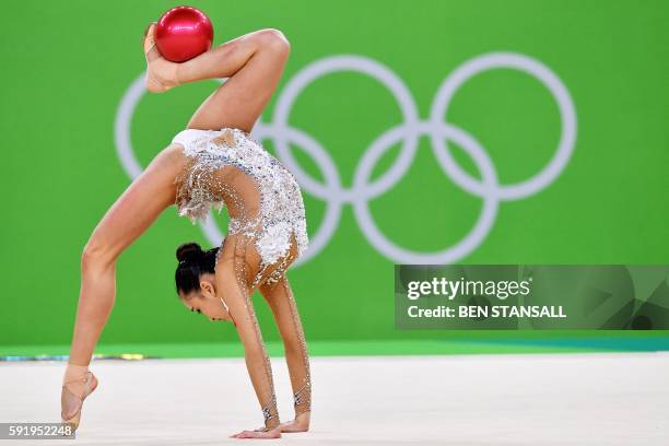South Korea's Son Yeon Jae competes in the individual all-around qualifying event of the Rhythmic Gymnastics at the Olympic Arena during the Rio 2016...