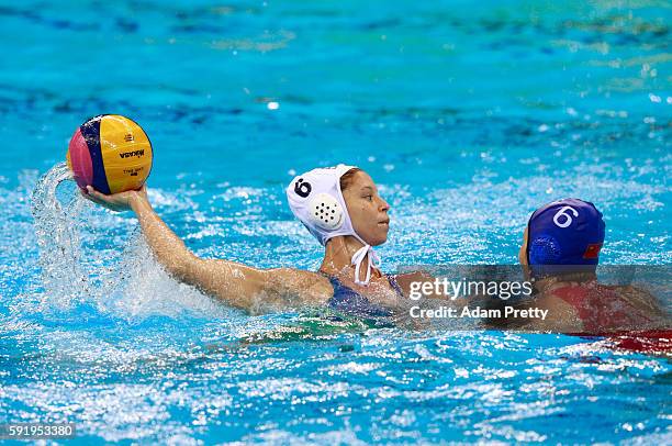 Izabella Chiappini of Brazil is challenged by Yating Sun of China during the Women's Water Polo 7th - 8th Classification match between Brazil and...