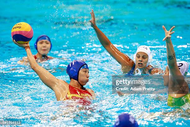 Xinyan Wang of China is challenged by Diana Abla of Brazil during the Women's Water Polo 7th - 8th Classification match between Brazil and China on...