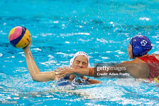 Diana Abla of Brazil is challenged by Cong Zhang of China during the Women's Water Polo 7th - 8th Classification match between Brazil and China on...