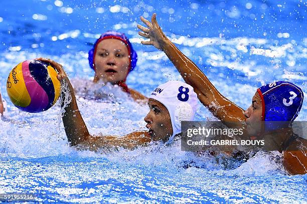 Hungary's Rita Keszthelyi vies with Russia's Ekaterina Prokofyeva during their Rio 2016 Olympic Games waterpolo Bronze medal match on August 19, 2016...