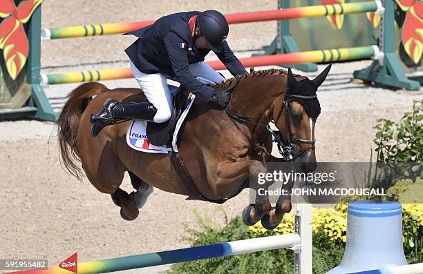 France's Roger-Yves Bost on his horse Sydney Une Prince takes part in the final round of the individual equestrian show jumping event at the Olympic...