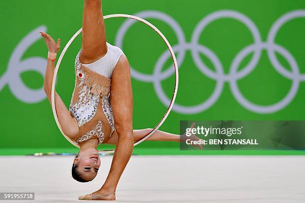 Japan's Kaho Minagawa competes in the individual all-around qualifying event of the Rhythmic Gymnastics at the Olympic Arena during the Rio 2016...