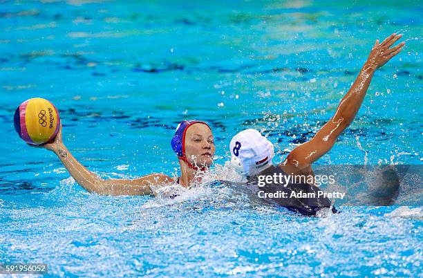 Evgeniya Ivanova of Russia is challenged by Rita Keszthelyi of Hungary during the Women's Water Polo Bronze Medal match between Hungary and Russia on...