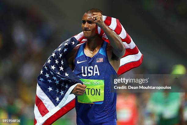 Ashton Eaton of the United States celebrates winning gold overall after the Men's Decathlon 1500m on Day 13 of the Rio 2016 Olympic Games at the...