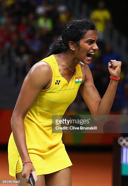 Sindhu Pusarla of India celebrates a point against Carolina Marin of Spain during the Women's Singles Gold Medal Match on Day 14 of the Rio 2016...