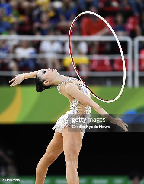 Japan's Kaho Minagawa performs with hoop during the rhythmic gymnastics individual all-around qualification at the Rio de Janeiro Olympics on Aug....