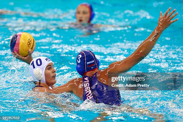 Barbara Bujka of Hungary is challenged by Ekaterina Prokofyeva of Russia during the Women's Water Polo Bronze Medal match between Hungary and Russia...