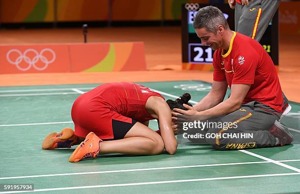 Spain's Carolina Marin reacts after winning against India's Pusarla V. Sindhu during their women's singles Gold Medal badminton match at the...