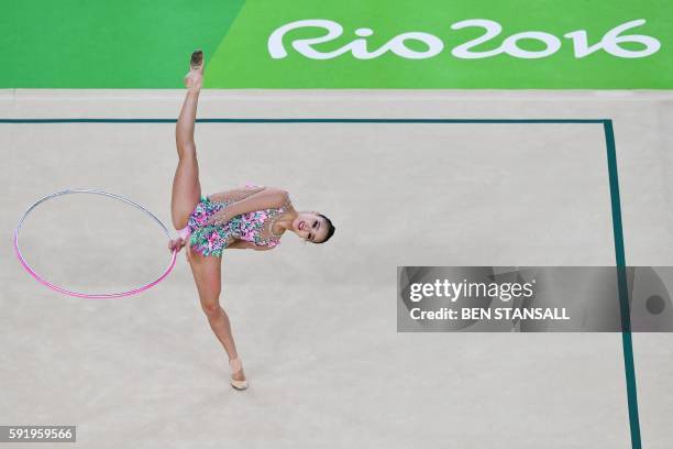 South Korea's Son Yeon Jae competes in the individual all-around qualifying event of the Rhythmic Gymnastics at the Olympic Arena during the Rio 2016...