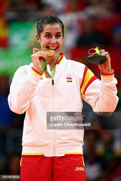 Gold medalist Carolina Marin of Spain celebrates during the medal ceremony after the Women's Singles Badminton competition on Day 14 of the Rio 2016...