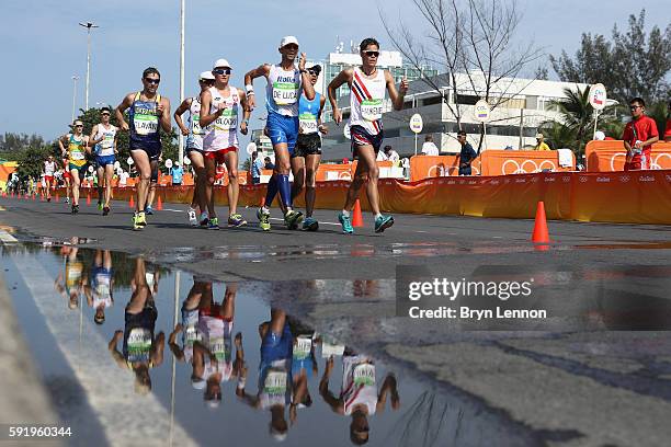 Marco de Luca of Italy and Havard Haukenes of Norway lead the pack during the Men's 50km Race Walk on Day 14 of the Rio 2016 Olympic Games at Pontal...