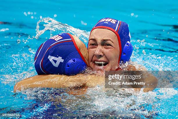 Elvina Karimova of Russia and Ekaterina Lisunova of Russia celebrate winning the bronze during the Women's Water Polo Bronze Medal match between...