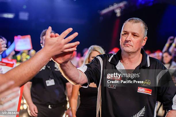 Rob Szabo walks-on to the stage for his match against Adrian Lewis during the first round of the Ladbrokes Sydney Darts Masters. Adrian Lewis won his...