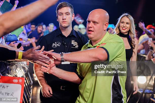 Michael van Gerwen walks-on to the stage for his match against Cody Harris during the first round of the Ladbrokes Sydney Darts Masters. Michael van...