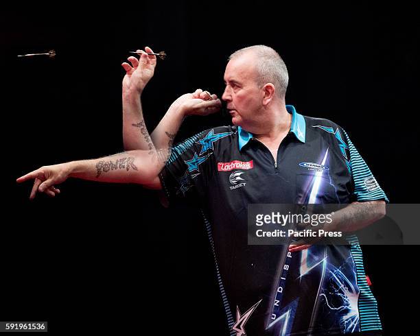 Composite image of sixteen times World Darts Champion Phil "The Power" Taylor as he plays a shot in his match against Australian star 21-year-old...