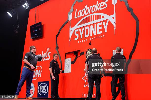 James Wade plays a shot in his match against Rhys Mathewson during the first round of the Ladbrokes Sydney Darts Masters. Rhys Mathewson caused a...