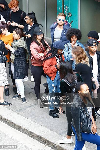 Shoppers queue to buy the latest apparel from Kanye West at the Kanye West temporary PABLO Store in 107 Bree Street on August 19, 2016 in Cape Town,...