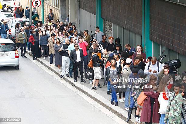 Shoppers queue to buy the latest apparel from Kanye West at the Kanye West temporary PABLO Store in 107 Bree Street on August 19, 2016 in Cape Town,...