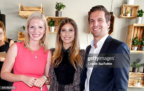 The Amorelie founder Lea-Sophie Cramer and Sebastian Pollok with Cathy Hummels during the Amorelie Wonderland dinner party at their new headquarter...