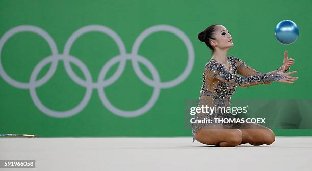 Japan's Kaho Minagawa competes in the individual all-around qualifying event of the Rhythmic Gymnastics at the Olympic Arena during the Rio 2016...