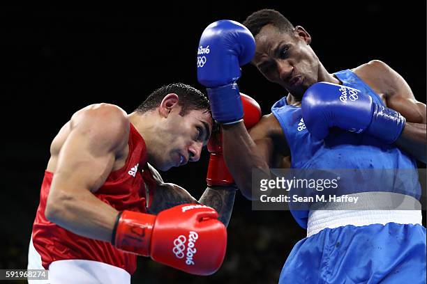 Artem Harutyunyan of Germany fights Lorenzo Sotomayor Collazo of Azerbaijan in the Men's Light Welter 64kg Semifinal 2 on Day 14 of the Rio 2016...