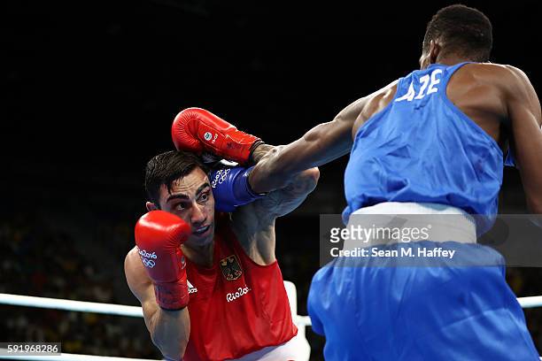 Artem Harutyunyan of Germany fights Lorenzo Sotomayor Collazo of Azerbaijan in the Men's Light Welter 64kg Semifinal 2 on Day 14 of the Rio 2016...