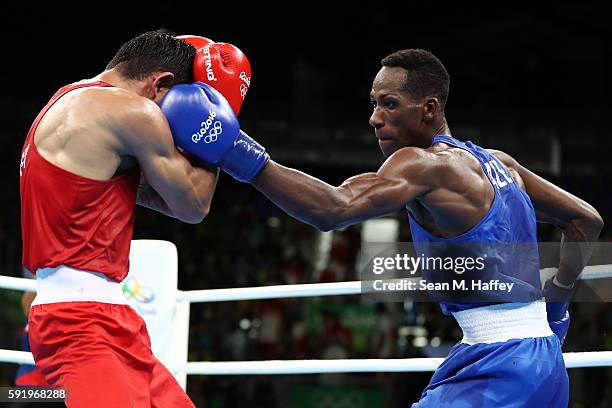 Artem Harutyunyan of Germany fights Lorenzo Sotomayor Collazo of Azerbaijan in the Men's Light Welter 64kg Semifinal 2 on Day 14 of the Rio 2016...