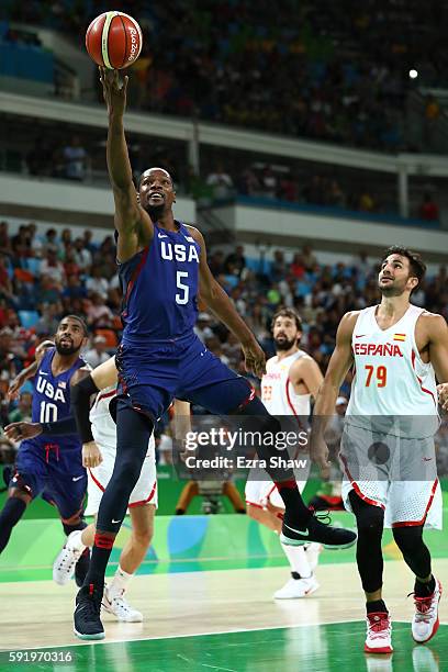 Kevin Durant of United States goes to the basket against Ricky Rubio of Spain during the Men's Semifinal match on Day 14 of the Rio 2016 Olympic...