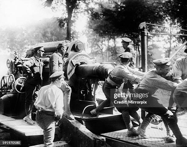 Canadian soldiers loading a shell into a 15 inch howitzer during an intense artillery bombardment prior to the beginning of The Battle of...