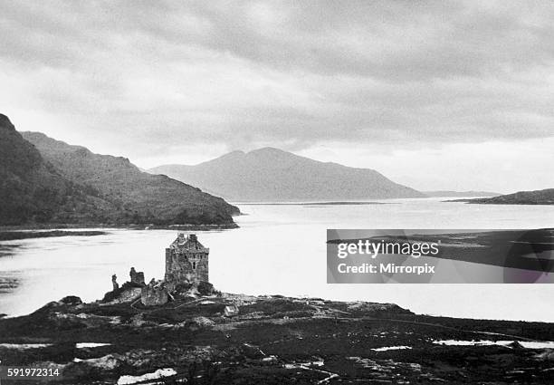 General view showing Eliean Donan Castle and Loch Duich with the hills of Skye in the distance across Loch Alsh. September 1929.